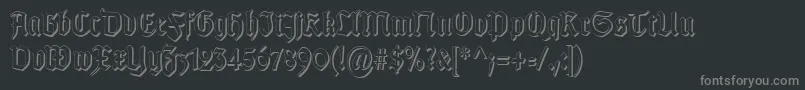 TypographergotischSchattenS-fontti – harmaat kirjasimet mustalla taustalla