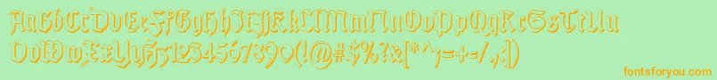 TypographergotischSchattenS-Schriftart – Orangefarbene Schriften auf grünem Hintergrund