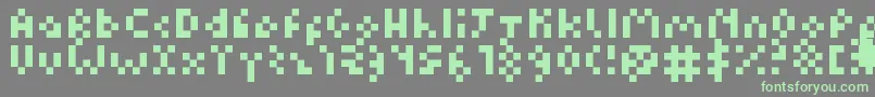 Fonte Kuadriculado7luas – fontes verdes em um fundo cinza
