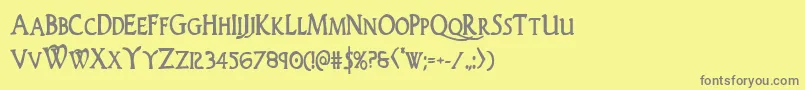 フォントWoodgodboldcond – 黄色の背景に灰色の文字