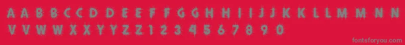 Thorn-Schriftart – Graue Schriften auf rotem Hintergrund