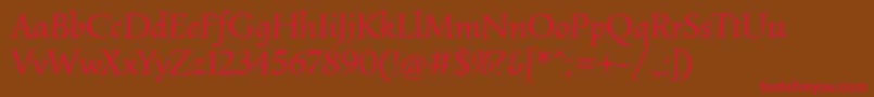 フォントSimonettaItalic – 赤い文字が茶色の背景にあります。