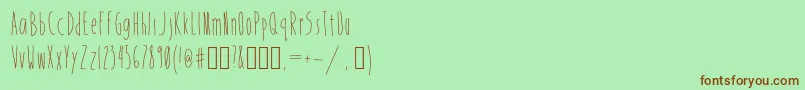 フォントMistress – 緑の背景に茶色のフォント