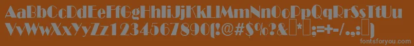 B821DecoRegular-fontti – harmaat kirjasimet ruskealla taustalla