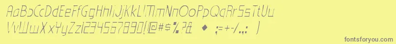 EdenmillsgauntItalic-fontti – harmaat kirjasimet keltaisella taustalla