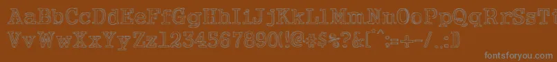 NeoWriter-fontti – harmaat kirjasimet ruskealla taustalla
