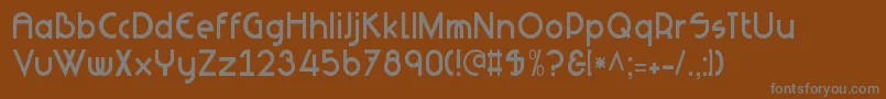 NeuesBauen-fontti – harmaat kirjasimet ruskealla taustalla