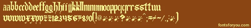 Artofilluminating-Schriftart – Gelbe Schriften auf braunem Hintergrund