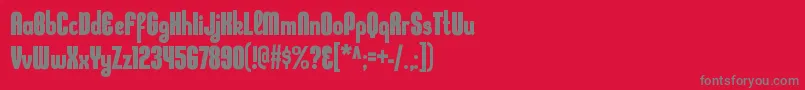 フォントKleptocracycdBold – 赤い背景に灰色の文字