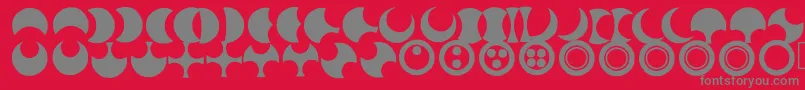 Moonogram-fontti – harmaat kirjasimet punaisella taustalla