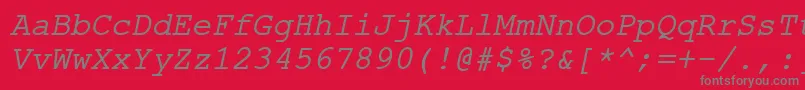 ErKurier866Italic-fontti – harmaat kirjasimet punaisella taustalla