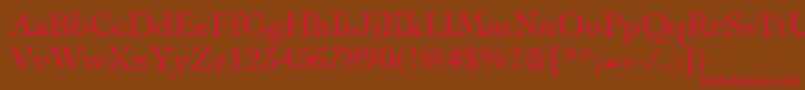 フォントCochinLt – 赤い文字が茶色の背景にあります。