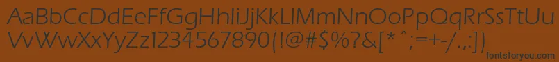 フォントErasbookc – 黒い文字が茶色の背景にあります