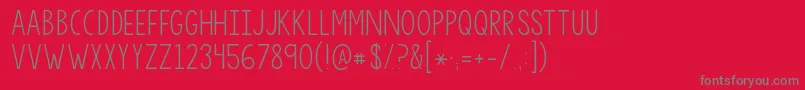 フォントKgsorrynotsorry – 赤い背景に灰色の文字