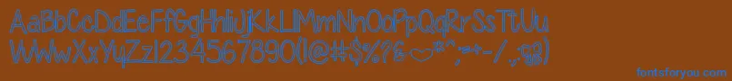 DiamondGirlHollow Font – Blue Fonts on Brown Background