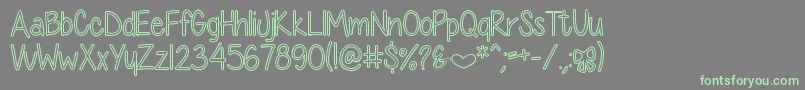 DiamondGirlHollow Font – Green Fonts on Gray Background