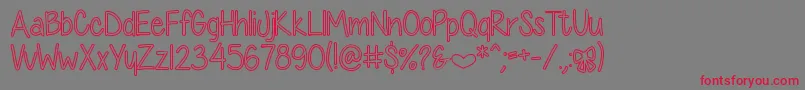 DiamondGirlHollow Font – Red Fonts on Gray Background