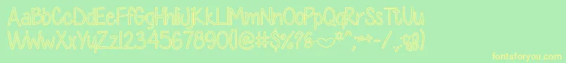 DiamondGirlHollow-fontti – keltaiset fontit vihreällä taustalla