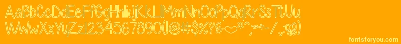 DiamondGirlHollow-fontti – keltaiset fontit oranssilla taustalla