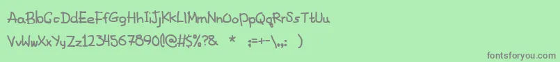 フォントFancyFootwork2 – 緑の背景に灰色の文字