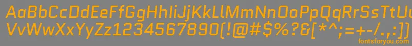 フォントQuanticoItalic – オレンジの文字は灰色の背景にあります。