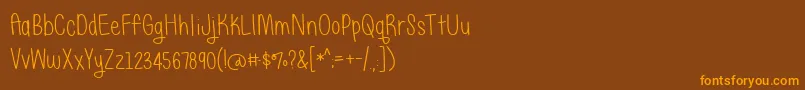 Шрифт JustAliceDemo – оранжевые шрифты на коричневом фоне
