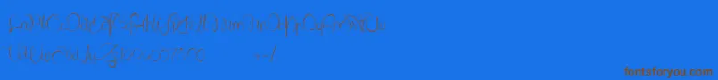 Czcionka LantreDuCaniche – brązowe czcionki na niebieskim tle