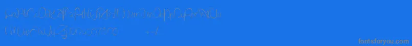 Czcionka LantreDuCaniche – szare czcionki na niebieskim tle