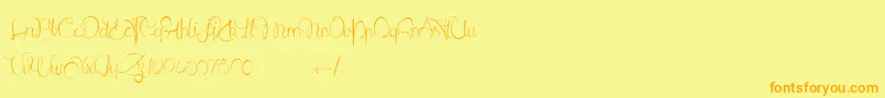 フォントLantreDuCaniche – オレンジの文字が黄色の背景にあります。