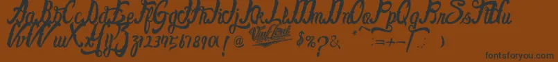 FayetScripts-fontti – mustat fontit ruskealla taustalla