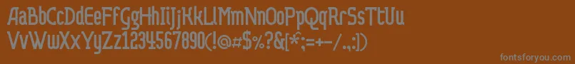 Dvaprobelac-Schriftart – Graue Schriften auf braunem Hintergrund