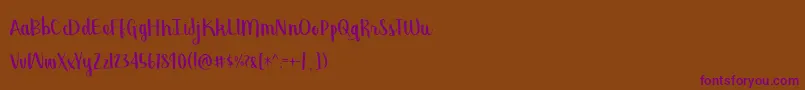 BmdGeorgina Font – Purple Fonts on Brown Background