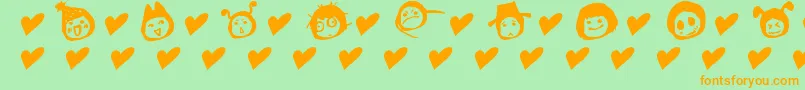 Czcionka SimplesnailsVer4.0OnlySymbols – pomarańczowe czcionki na zielonym tle