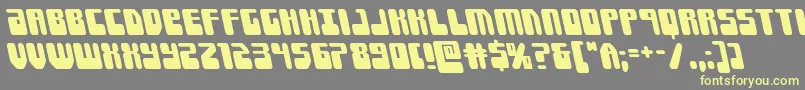 Forcemajeureleft-Schriftart – Gelbe Schriften auf grauem Hintergrund