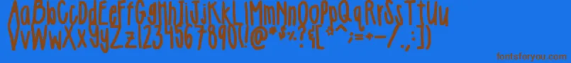 フォントGirlie – 茶色の文字が青い背景にあります。