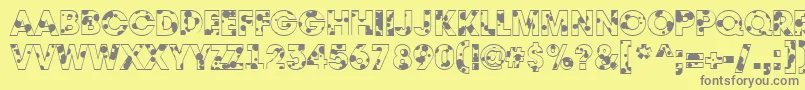フォントAAvantedrp – 黄色の背景に灰色の文字