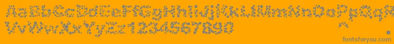 Więcej informacji o czcionce Alphabet05 Czcionka Alphabet05 – szare czcionki na pomarańczowym tle