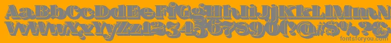 FatFlamingo5ShadowFill-Schriftart – Graue Schriften auf orangefarbenem Hintergrund