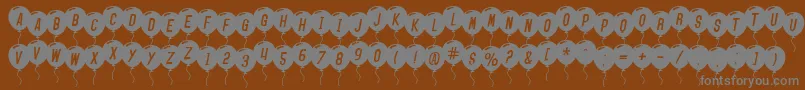 Weitere Informationen zur SfBalloonsItalic-Schriftart SfBalloonsItalic-Schriftart – Graue Schriften auf braunem Hintergrund