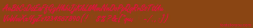 フォントFreestyleScriptBoldPlain – 赤い文字が茶色の背景にあります。