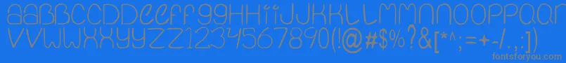 QuietInfinity-fontti – harmaat kirjasimet sinisellä taustalla