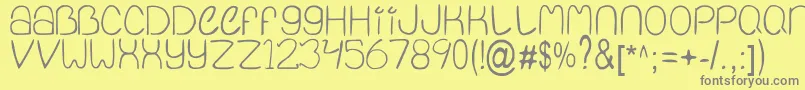 フォントQuietInfinity – 黄色の背景に灰色の文字