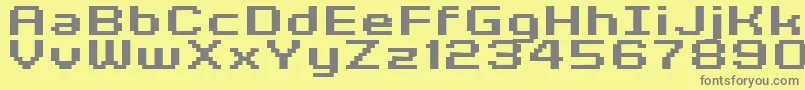 フォントKyrou7WideBoldXtnd – 黄色の背景に灰色の文字