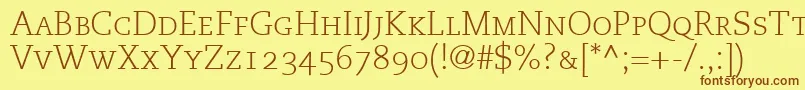 フォントMonologueLightCapsSsiLightSmallCaps – 茶色の文字が黄色の背景にあります。