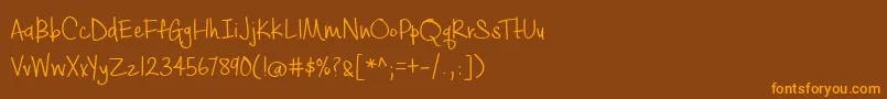 フォントBmdCashewAppleAle – オレンジ色の文字が茶色の背景にあります。