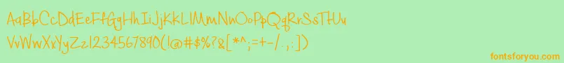 フォントBmdCashewAppleAle – オレンジの文字が緑の背景にあります。