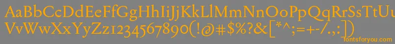 フォントJannonTModerneOt – オレンジの文字は灰色の背景にあります。