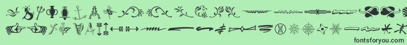 フォントTypeembellishmentsthree – 緑の背景に黒い文字