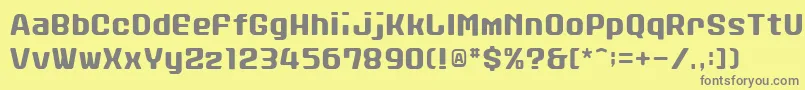 フォントStanleyAlphabet – 黄色の背景に灰色の文字