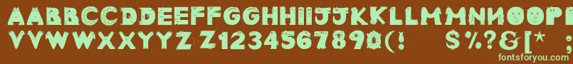 フォントAnimaltypefaces – 緑色の文字が茶色の背景にあります。